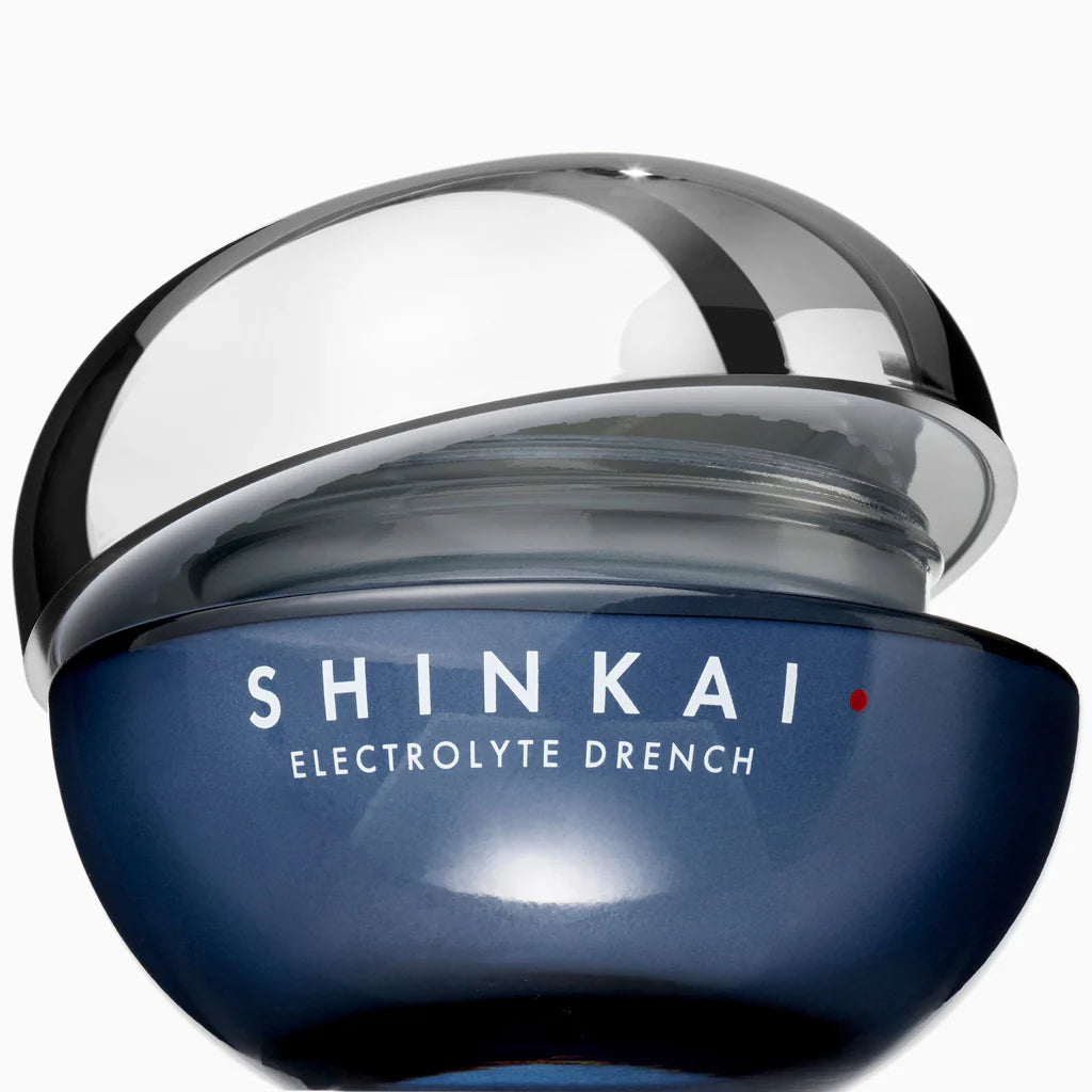 Blue skincare product container with 'Shinkai' branding on a white background