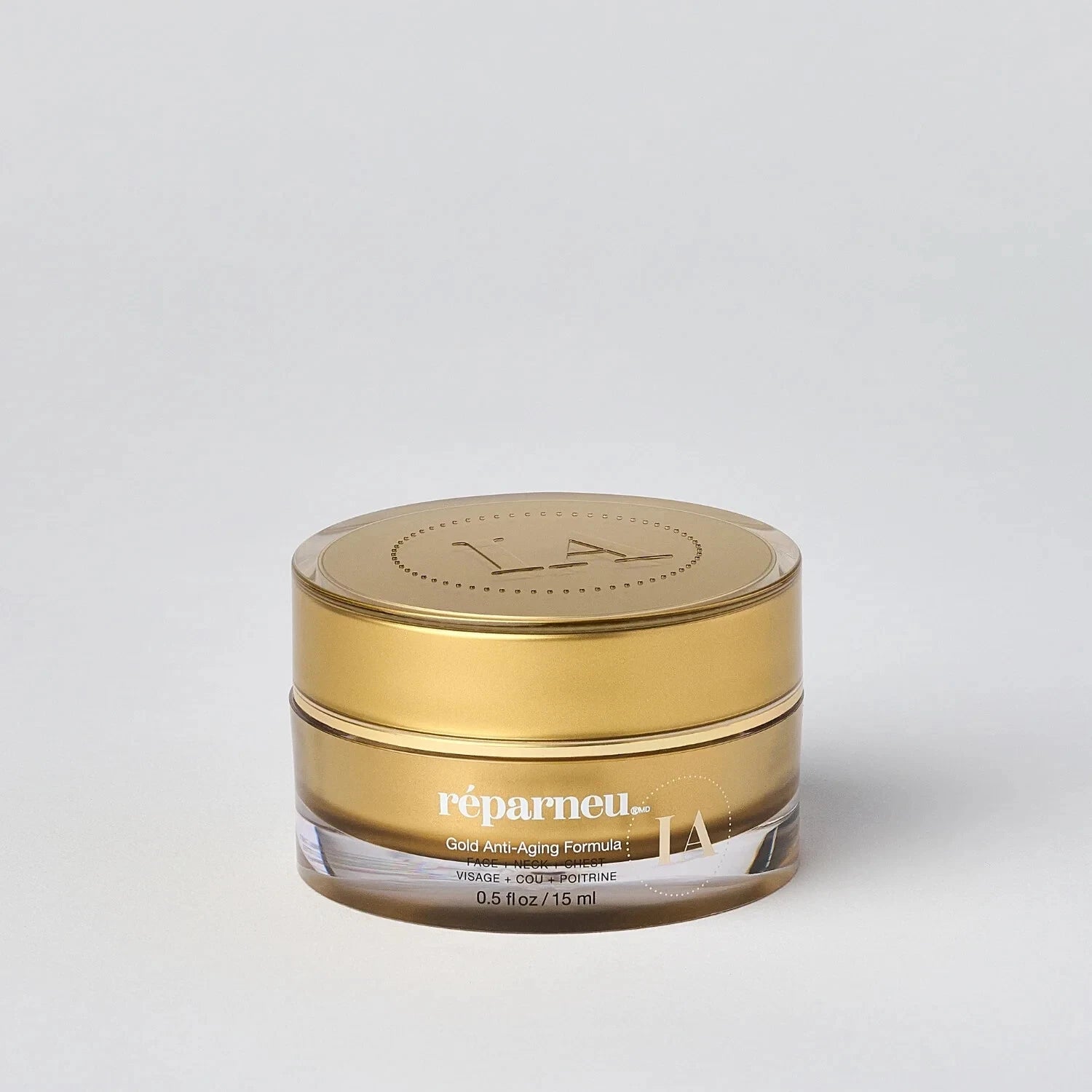 InfinitAloe Gold anti-aging face and neck cream in a 15ml jar, showcasing the luxurious gold formula for skin care.