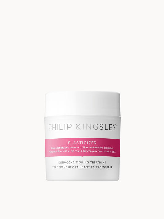 Philip Kingsley Elasticizer deep-conditioning treatment in a white jar with a pink label band, centered on a light gray background.