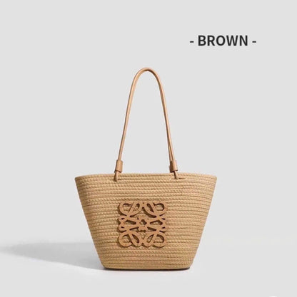 Chic Raffia woven straw tote bag from Grace Beauty, stylish handbag with natural textured straw material and sturdy handles.