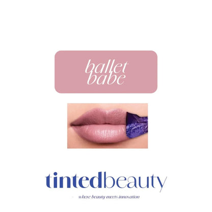 Tinted Beauty Peel & Reveal Lip Tint in Ballet Babe, showcasing the long-lasting makeup product in a sleek tube with a applicator brush.