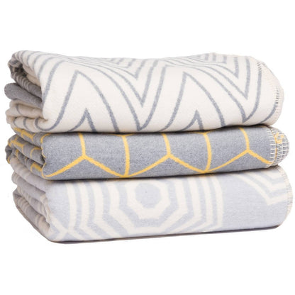 Grey Atlanta Parasol bed throw blanket on a bed, featuring a soft, cozy fabric in a single size for bedroom comfort.